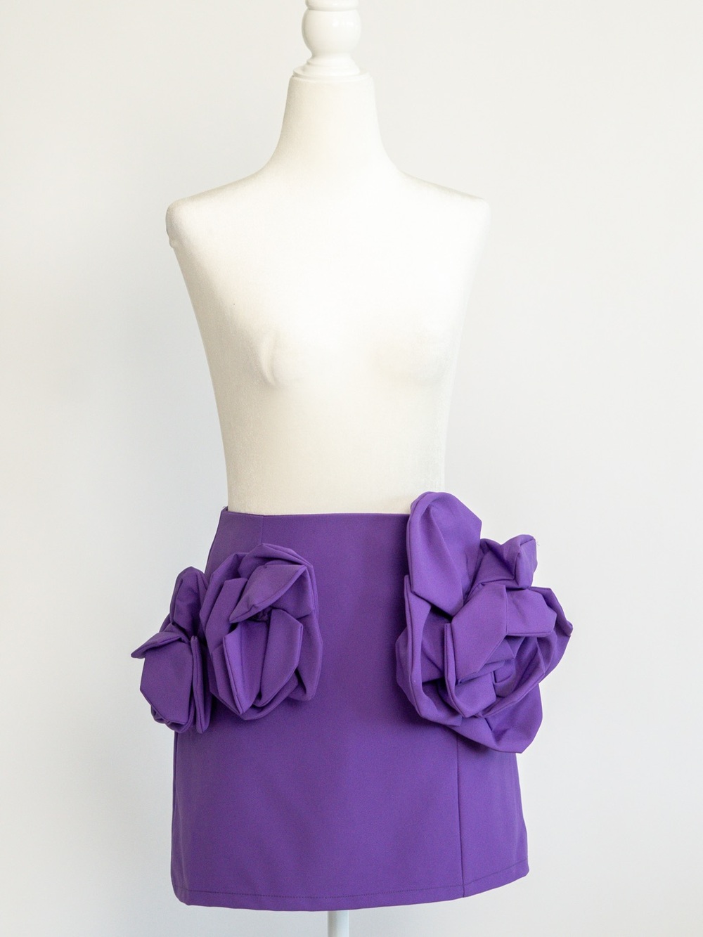 AKIRA Violet Mini Skirt with Sculpted Floral Accents